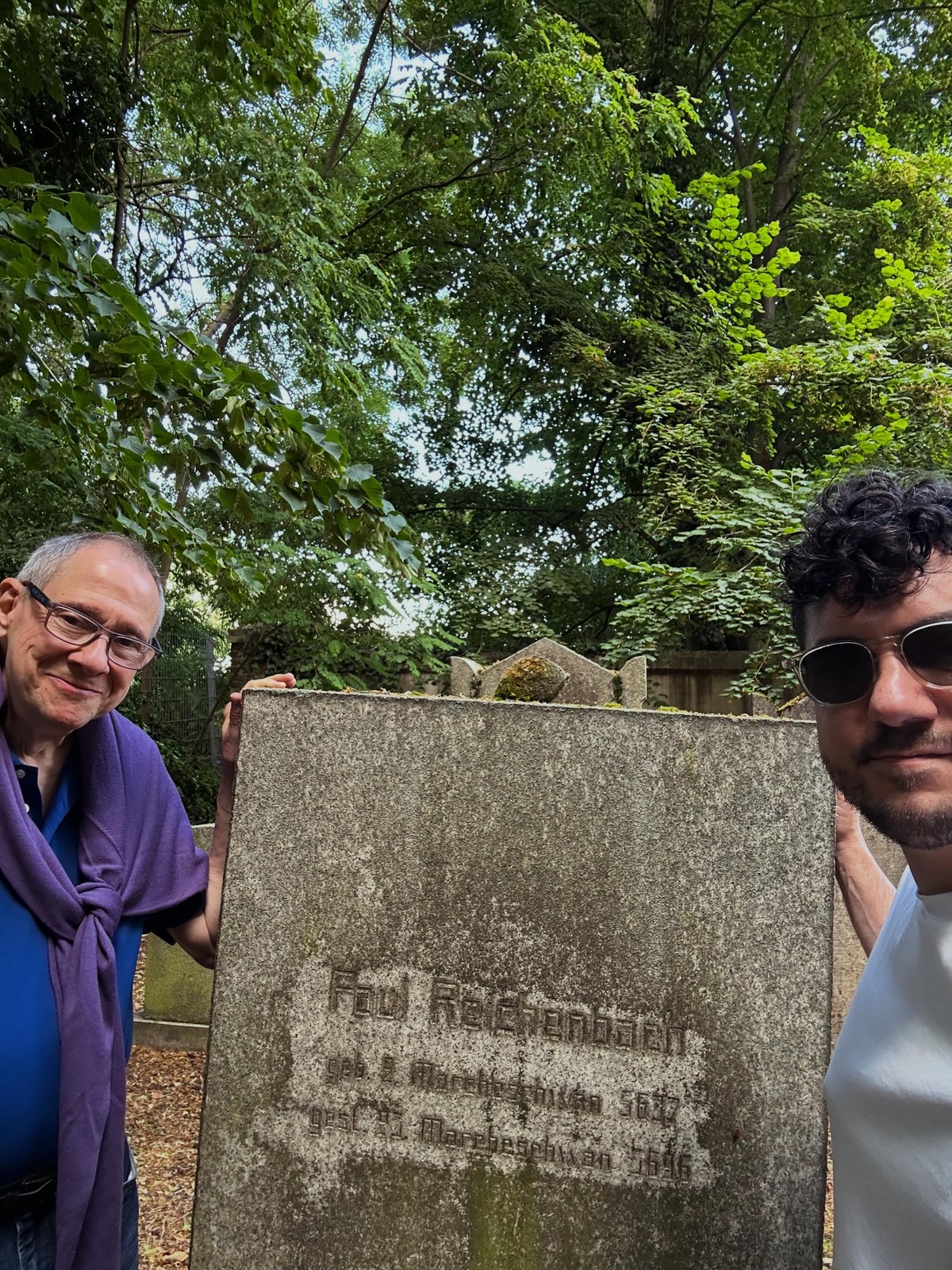 Paul J. Reichenbach and Rabbi Daniel Dolph Reichenbach beside the gravestone of Paul Reichenbach in Halberstadt