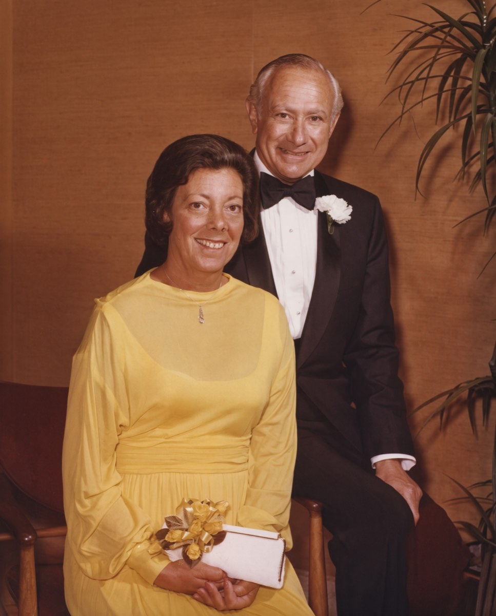 Enhanced color presentation image of Susan “Subie” Ulmer Reichenbach in a yellow dress seated beside Adolf “Dolf” Reichenbach in a tuxedo later in their lives