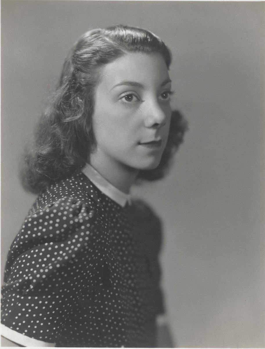 Black-and-white studio portrait of Susan “Subie” Ulmer Reichenbach at about seventeen or eighteen years old, wearing a dark polka-dot dress