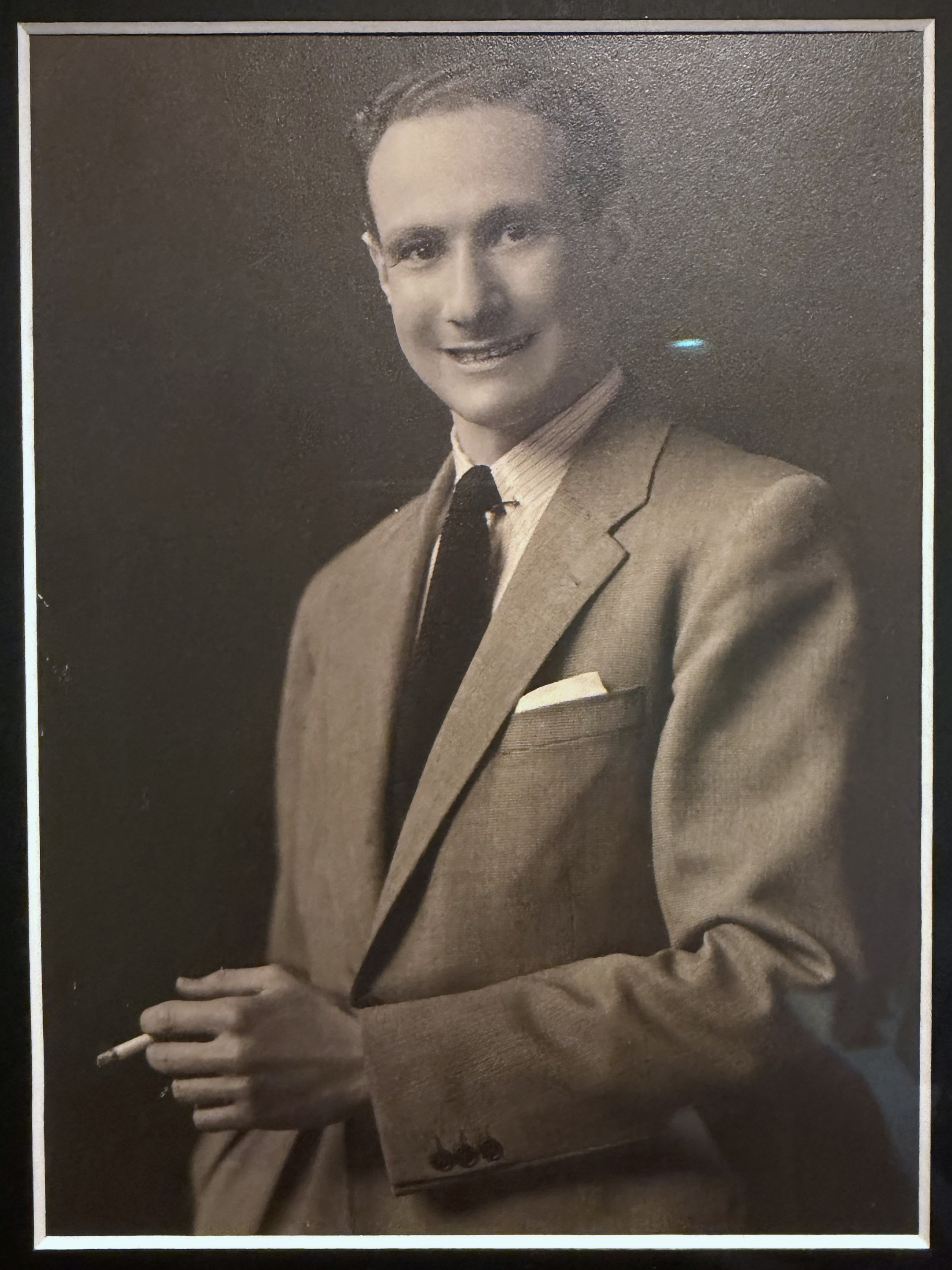 Full-length studio portrait of Adolf Dolf Reichenbach in a light suit as a young man