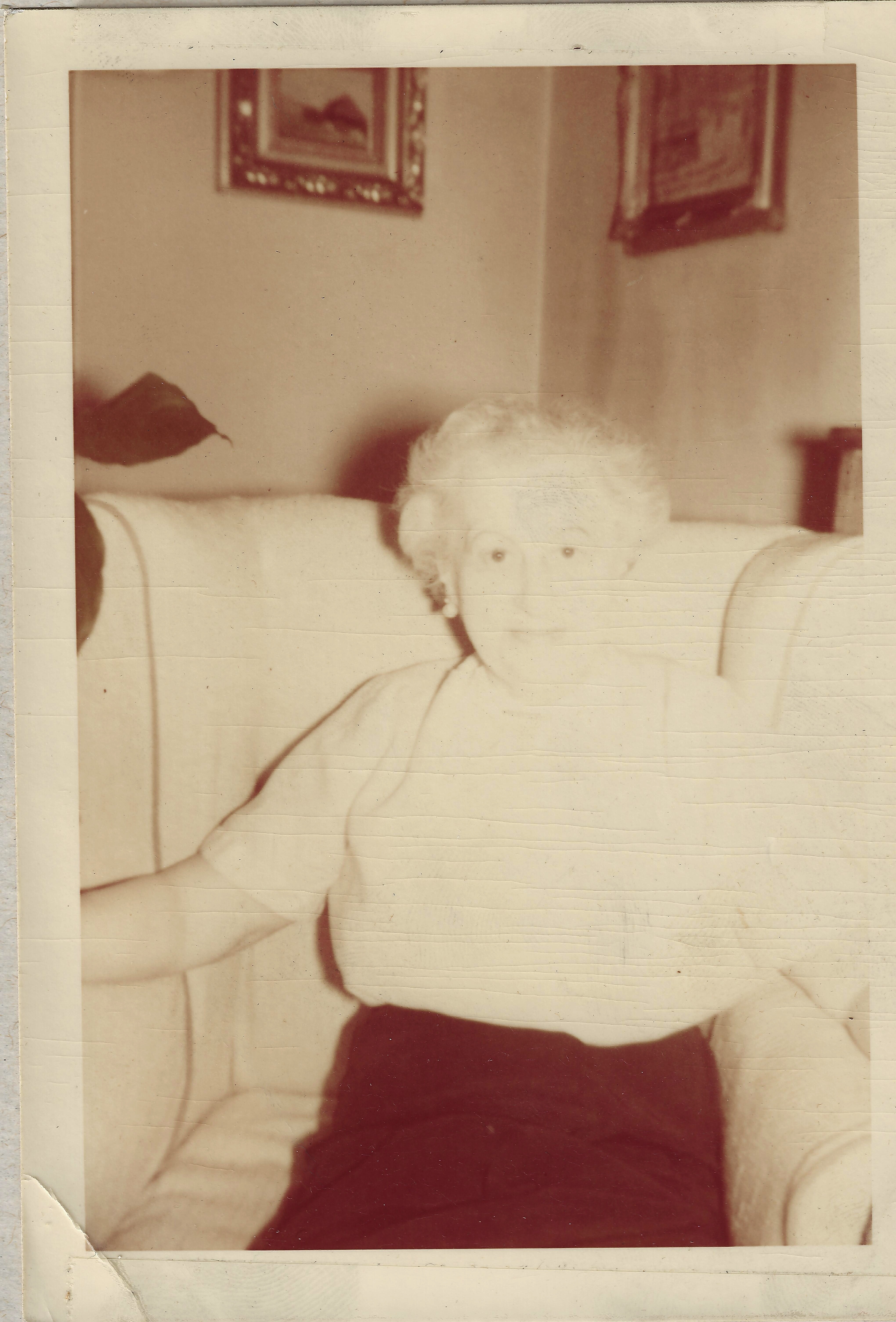 Late-life portrait of Margarete Mutti Reichenbach seated in an upholstered armchair at home