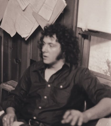 A young Paul J. Reichenbach seated in an office or cabin during his early career