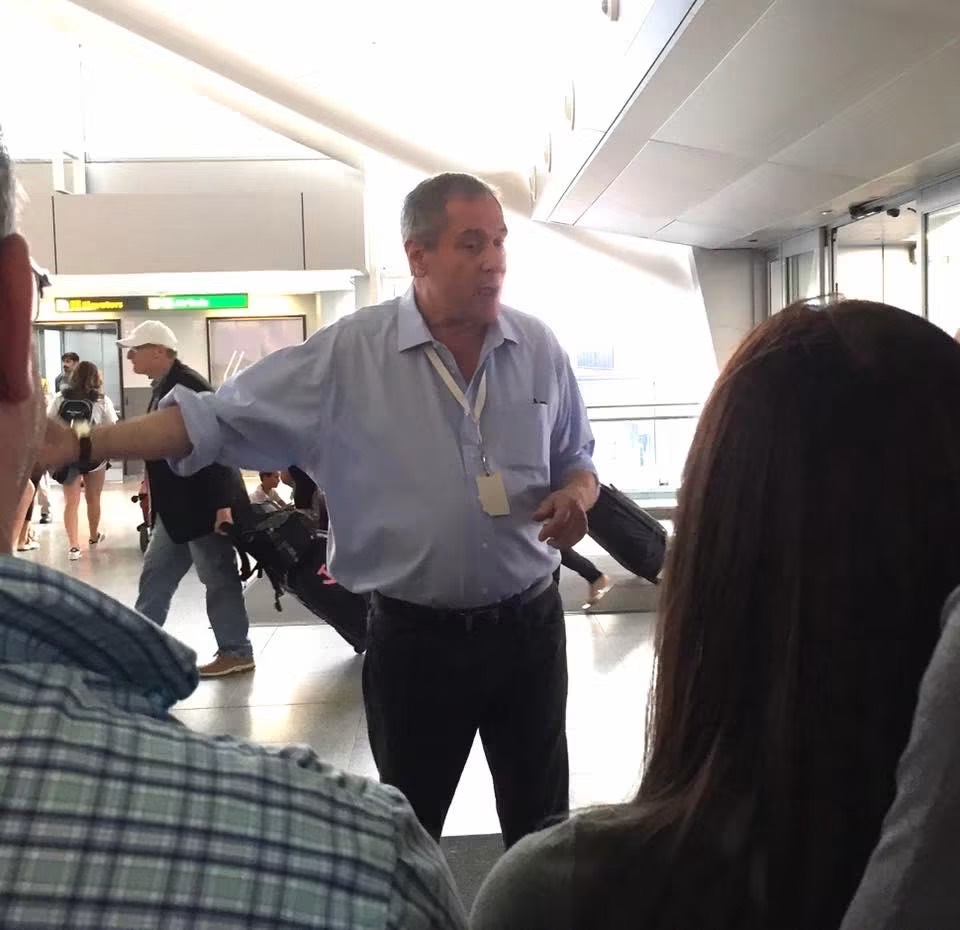 Paul J. Reichenbach speaking to a group of teens at John F. Kennedy International Airport