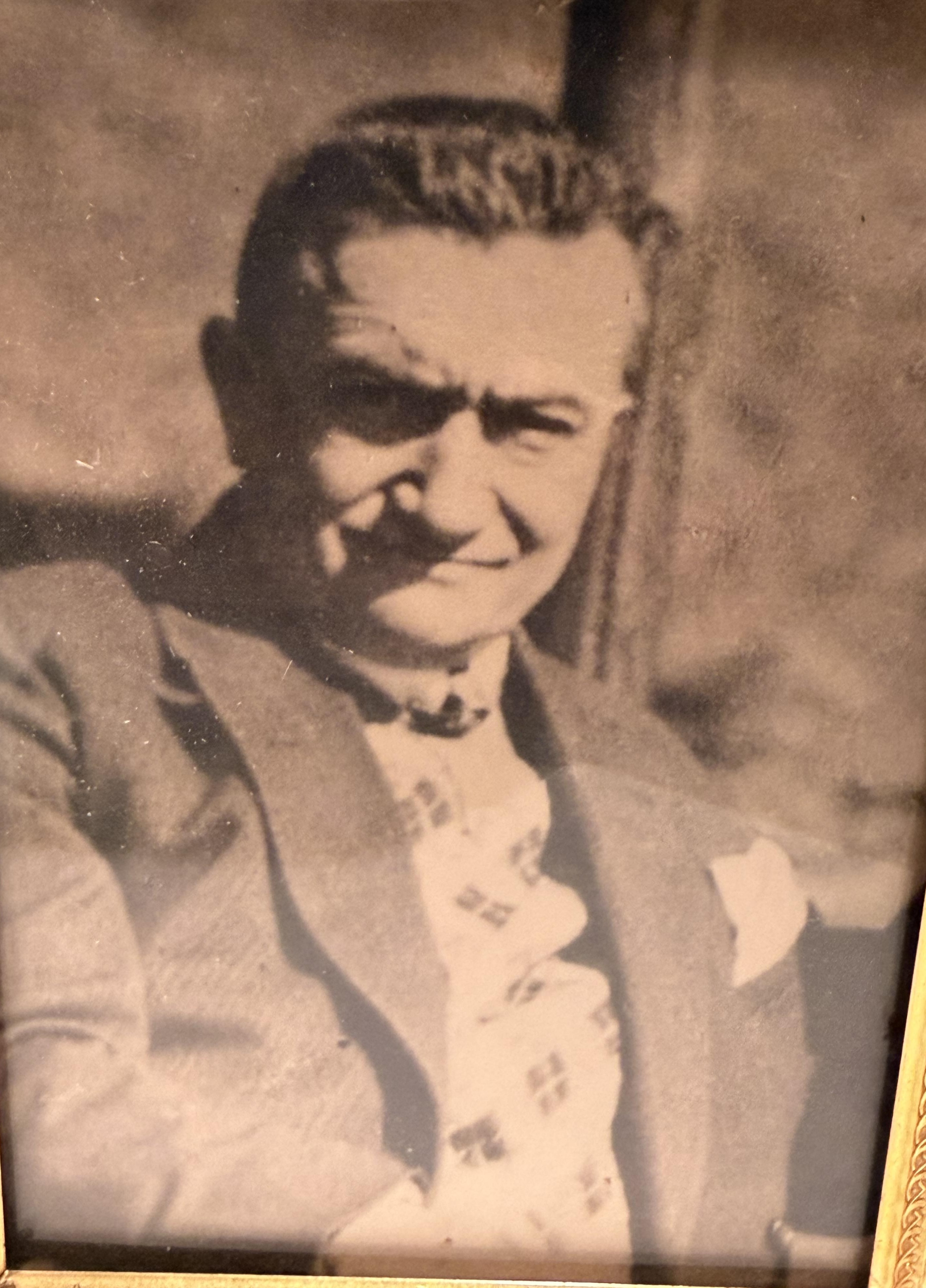 Framed midlife portrait of Paul Reichenbach in a suit